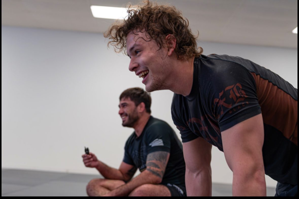 Students laughing between rounds at Ares BJJ Omaha