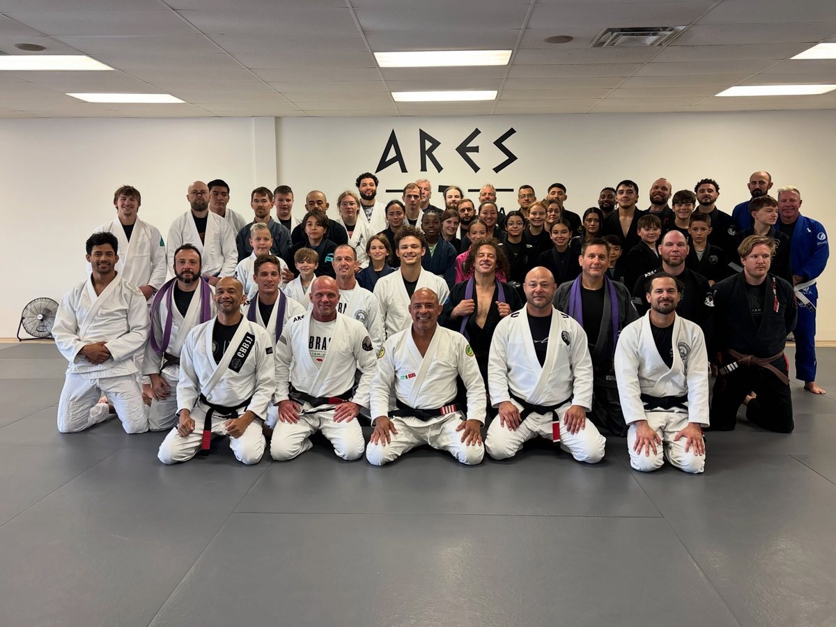 The full Ares BJJ Omaha academy, adults and kids, gathered on the mats for a group photo