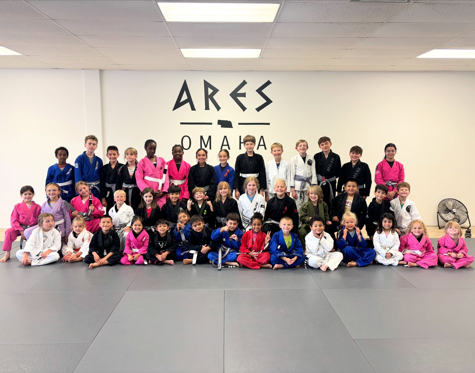 The Ares BJJ Omaha kids class together on the mats